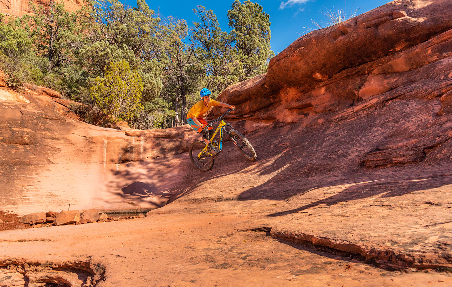 Mountain Biker Lauren Gregg cruising red rock of Sedona, Az. Daniel Britton, Lifestyle, Adventure Photographer
